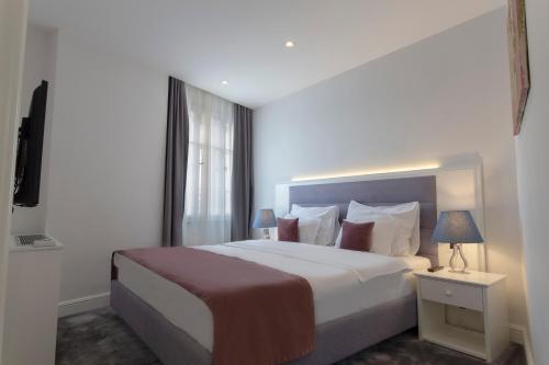 Postel nebo postele na pokoji v ubytování Public House Hotel