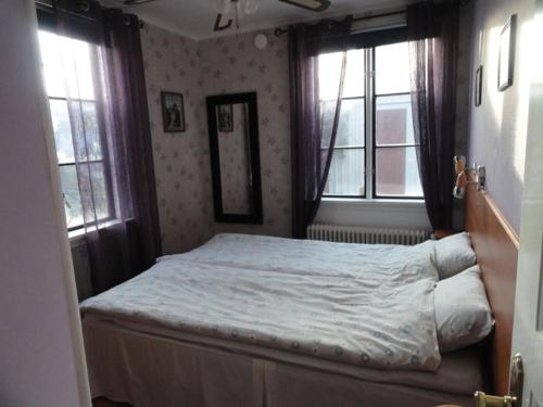 מיטה או מיטות בחדר ב-Kalkstenens Bed and Breakfast