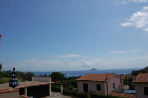 a view of the ocean from a house at monolocale 2 Planasia in Cavo