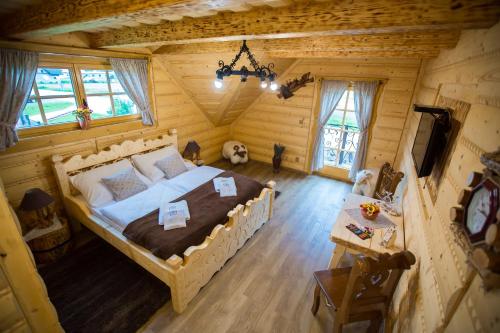 an overhead view of a bedroom in a log cabin at Zbojnicky penzion in Oravska Jasenica