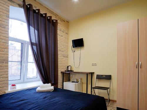 
Кровать или кровати в номере Невский 147
