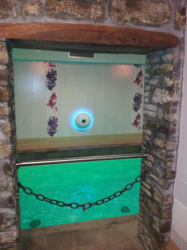 a fish tank with a chain around it at Agriturismo Prato degli Angeli in Sassoleone