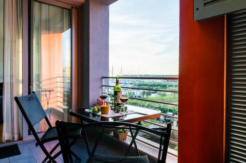 a balcony with a table and two chairs and a window at APP - 1 in Novigrad Istria