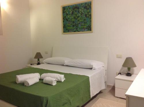 Postel nebo postele na pokoji v ubytování Sole !! Cagliari centro