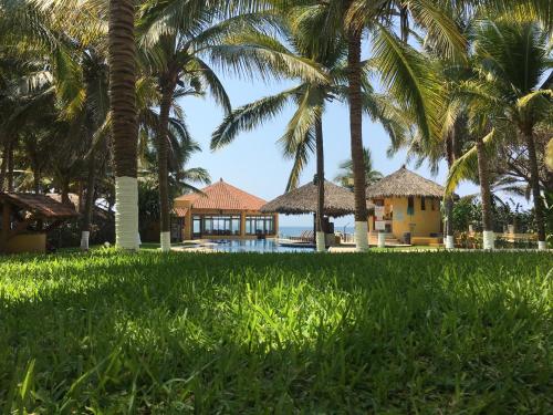 a view of a resort with palm trees at Hotel Bella vista in Zihuatanejo
