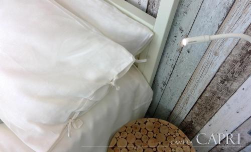 a close up of a pillow and a basket of nuts at B&b Torre del Greco in Torre del Greco