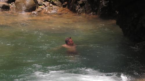 a person in the water in a river at EYA Ecolodge in San Isidro