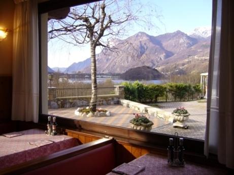 a window with a view of a mountain view at Hotel La Solitaria in Carlazzo