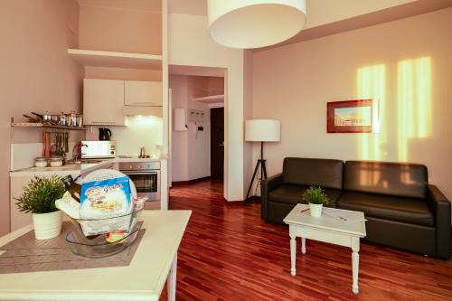 a living room with a baby in a basket on a table at Culture Residence Consalvo Otto in Naples