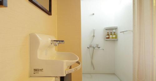 a bathroom with a sink and a shower at 41-2 Surugamachi - Hotel / Vacation STAY 8330 in Nara