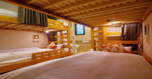 a bedroom with two bunk beds and a bathroom at 41-2 Surugamachi - Hotel / Vacation STAY 8338 in Nara