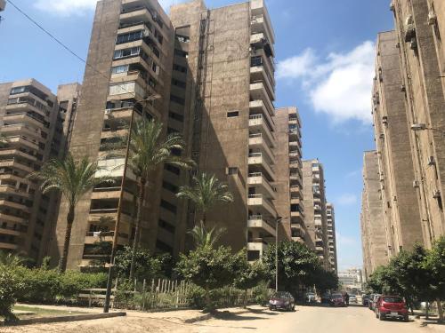 a view of two tall buildings in a city at Elegant apartment in the middle of Alexandria for long term in Alexandria