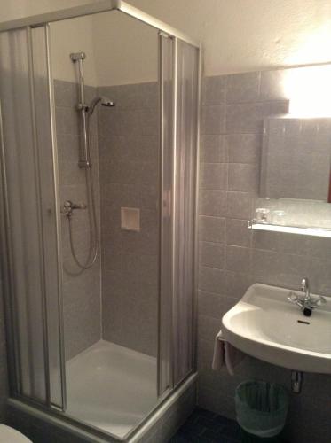 a bathroom with a shower and a sink at Parkhotel Zuzek in Sankt Kanzian