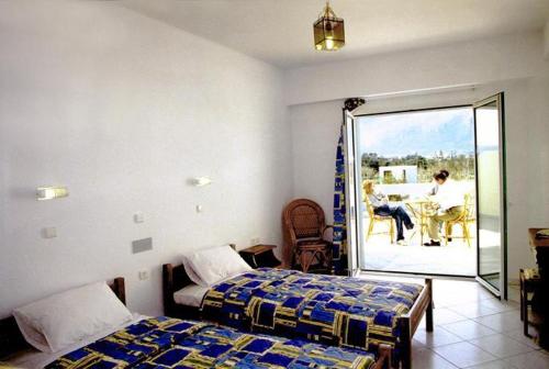 En eller flere senger på et rom på Eleni Palace