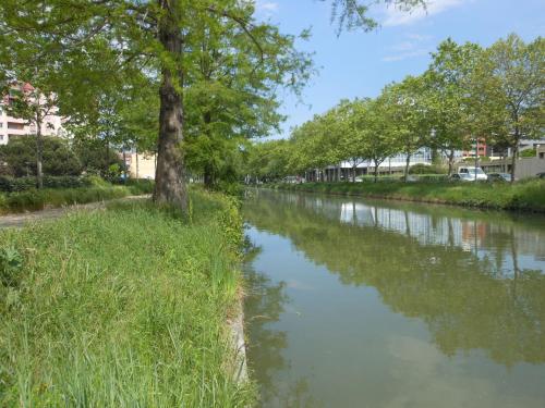 a river with trees on the side of it at B&B HOTEL Toulouse Centre Canal du Midi in Toulouse