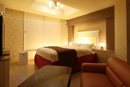 En eller flere senge i et værelse på Hotel Fine Olive Kyoto Yamashina (Adult Only)