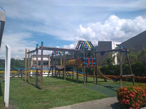 a playground in a park with a slide at Cabaña Ciudadela Premium San Jeronimo in San Jerónimo