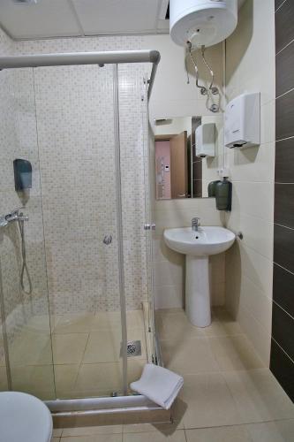 a bathroom with a shower and a sink at Luxury Skopje Apartments Premium in Skopje