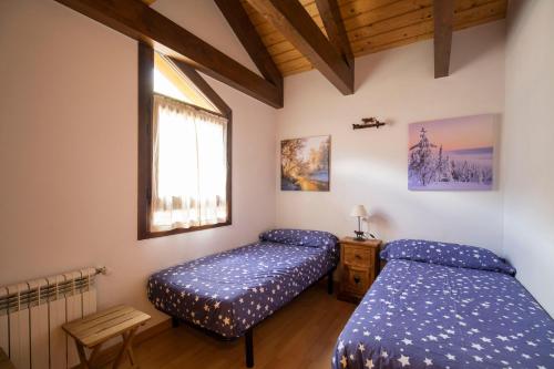 Katil atau katil-katil dalam bilik di Prau Llargo