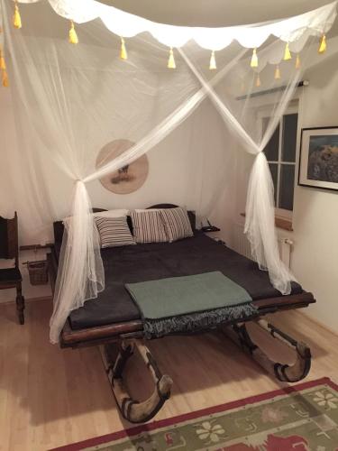 a bedroom with a bed in a tent at KU:L Apartment 4pers. Planai Dachstein in Öblarn