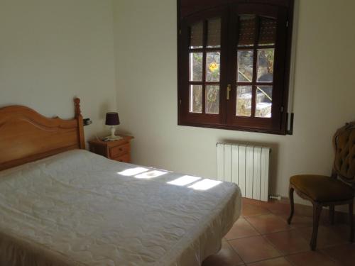 Huesca 19 tesisinde bir odada yatak veya yataklar