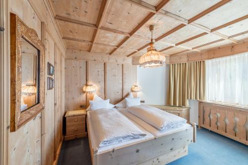 Postel nebo postele na pokoji v ubytování Apart Hotel Garni Wieser