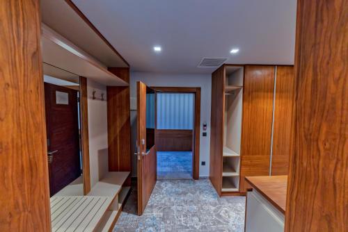 a room with wooden cabinets and a hallway at Heritage Hotel Krone in Sarajevo