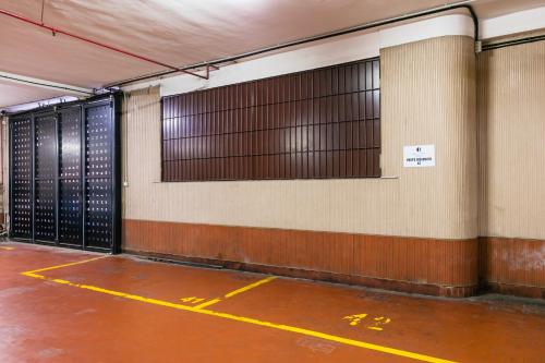 an empty parking garage with a bunch of doors at Culture Residence Consalvo Otto in Naples