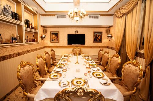 a large dining room with a long table and chairs at Hotel Boyana - Free Parking in Sofia