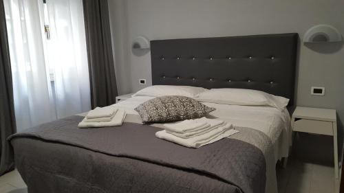Postel nebo postele na pokoji v ubytování Hotel Milano
