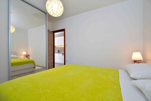 Postel nebo postele na pokoji v ubytování Apartment Kristina