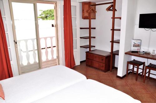 Una cama o camas en una habitación de Hotel MiraBela