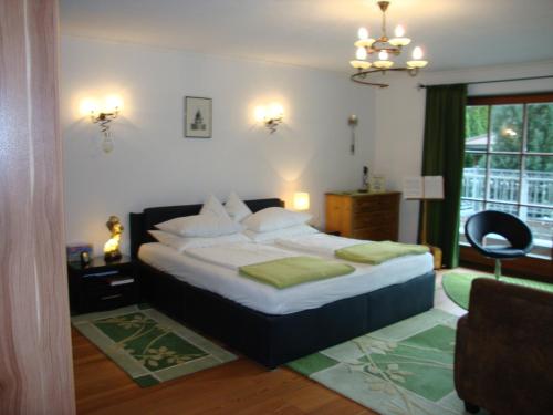 a bedroom with a large bed and a window at Haus Andreas in Kitzbühel