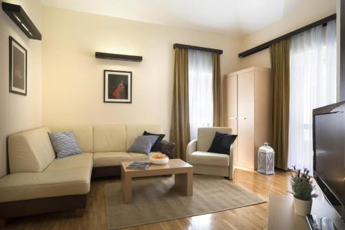 a living room with a couch and a table at Apartment ACI Marina CRES in Cres