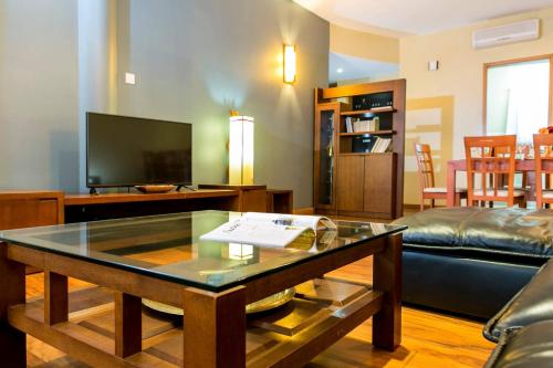 a living room with a couch and a coffee table at Enkombe Place in Kampala