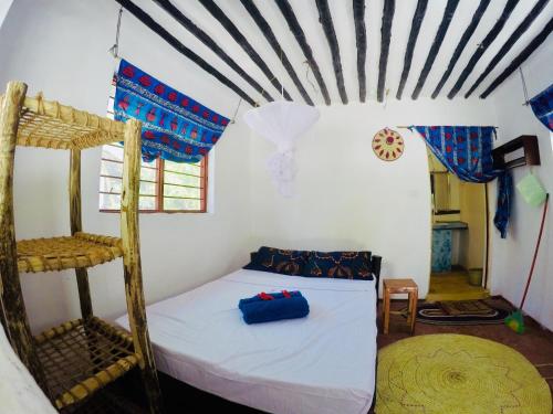 Postel nebo postele na pokoji v ubytování Evergreen Bungalows