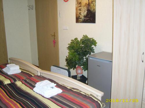 a bedroom with a bed with towels on it at B & B Gross Methling in Dargun