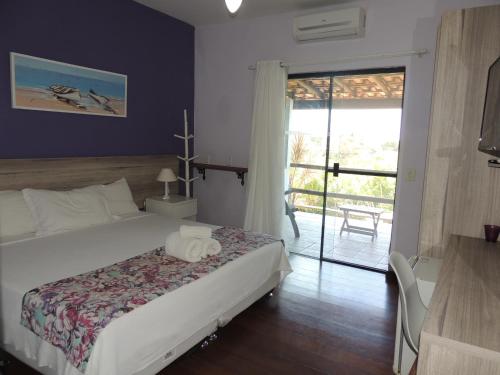 Ένα ή περισσότερα κρεβάτια σε δωμάτιο στο Pousada Akaroa