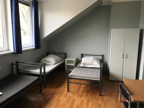 Llit o llits en una habitació de Hostel pod Topolami