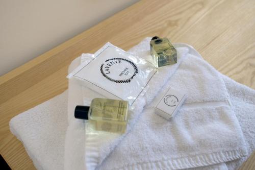 a white towel with two bottles of soap on a table at Royal Maritime Hotel in Portsmouth