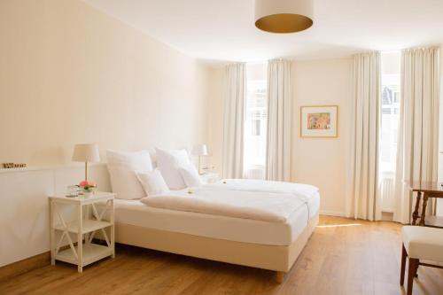 Ένα ή περισσότερα κρεβάτια σε δωμάτιο στο Krone Martinsthal