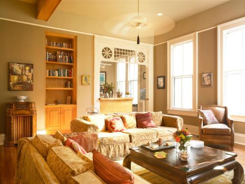 a living room with a couch and a coffee table at Maison Perrier Bed & Breakfast in New Orleans