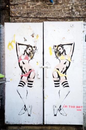 a painting of two women in doors on a wall at The Z Hotel Shoreditch in London