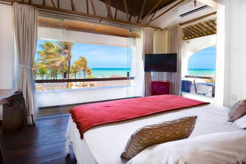 Postel nebo postele na pokoji v ubytování Vila Coqueiros Boutique Hotel