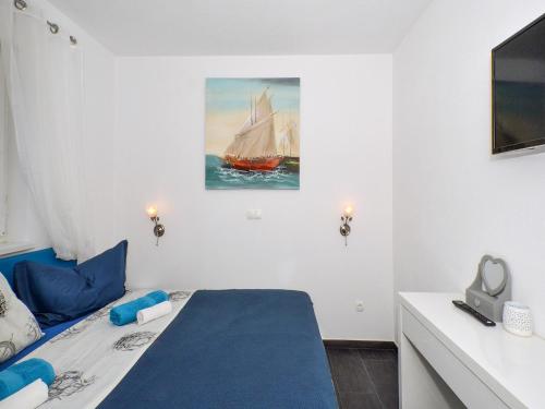 Postel nebo postele na pokoji v ubytování Deluxe Apartman Porto