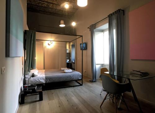Postel nebo postele na pokoji v ubytování Il Coro delle Nuvole