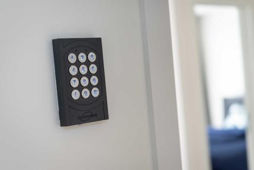 a door with a remote control attached to it at Studio Brussels Airport - South in Zaventem