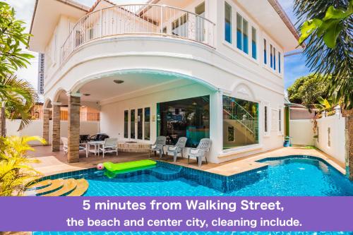 a villa with a swimming pool and a house at TEWAREE VILLA - PATTAYA HOLIDAY HOUSE WALKING STREET 4 bedrooms in Pattaya South