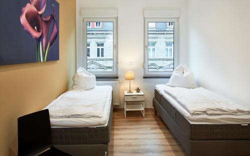Ένα ή περισσότερα κρεβάτια σε δωμάτιο στο Apartments 4 YOU - Goethestraße