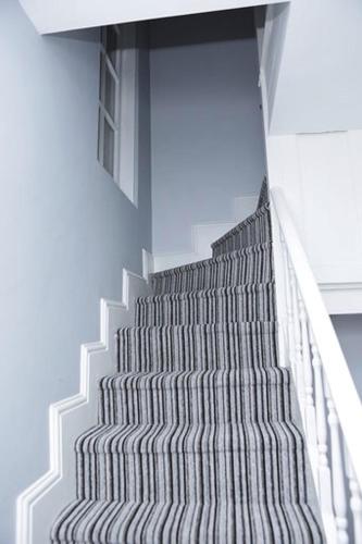 a spiral staircase in a building with the sky at The Spring Bank APARTHOTEL in Preston